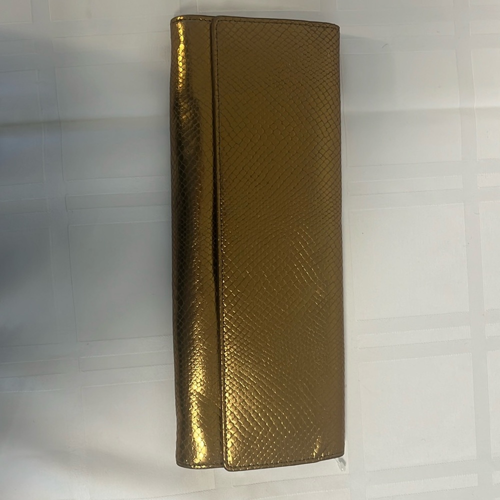 Bronze Metalic envelope purse NWOT
vinyl snake skin